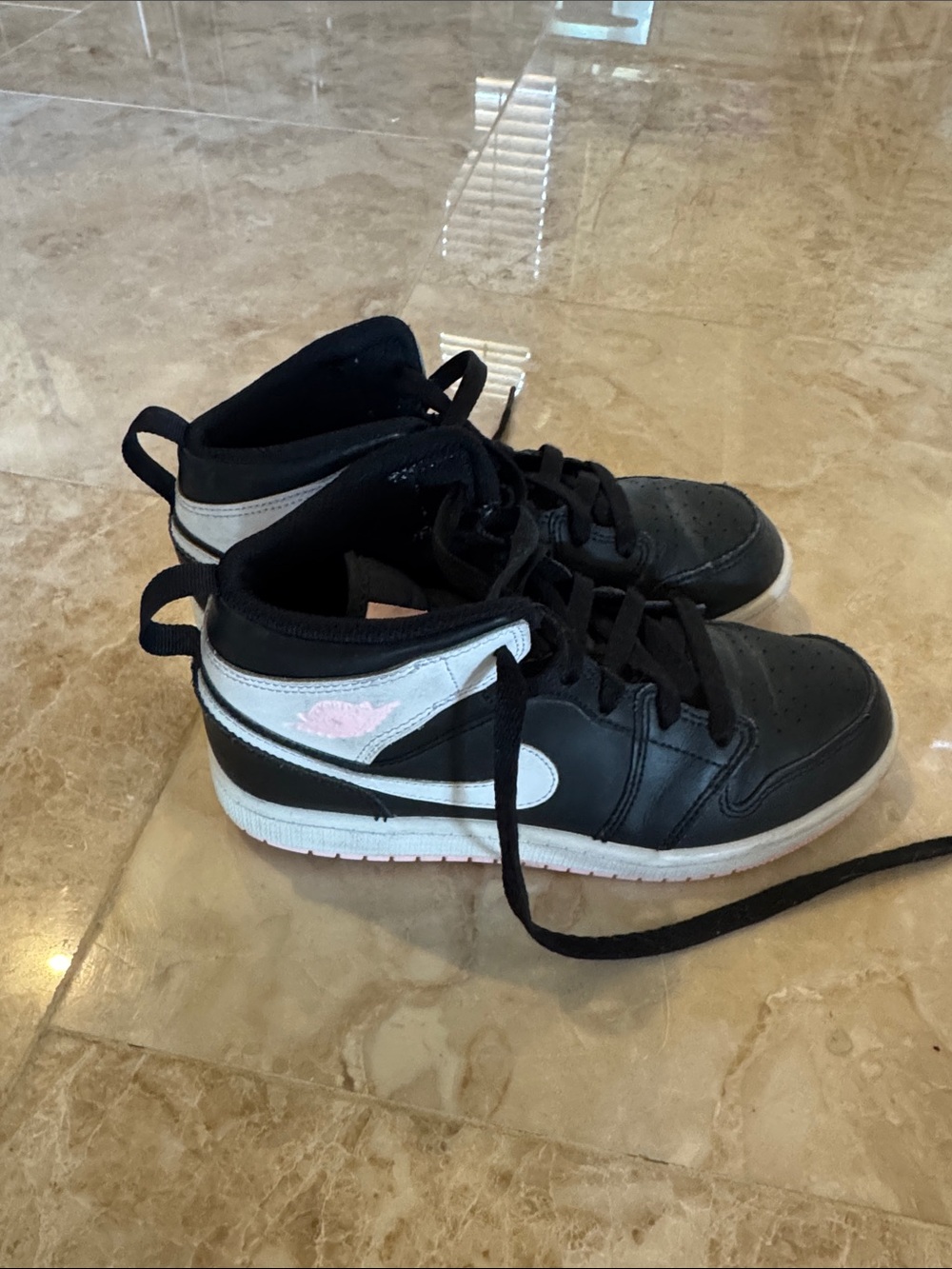 Jordan Black High-Top Sneakers with White Midsole and Pink Tongue Logo